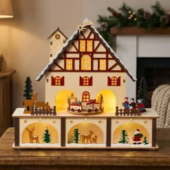 KAEMINGK Villaggio Di Natale In Legno-Villaggio di Natale in legno luminoso e musicale a pile (27 x H24 cm) Chalet Svizzero Colorato